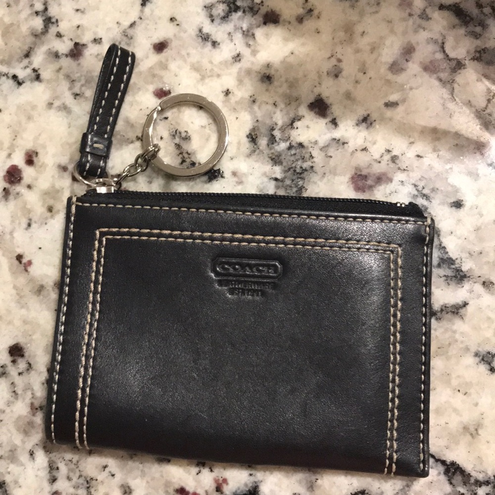 Coach coin purse with 2 pockets; 1 is zippered